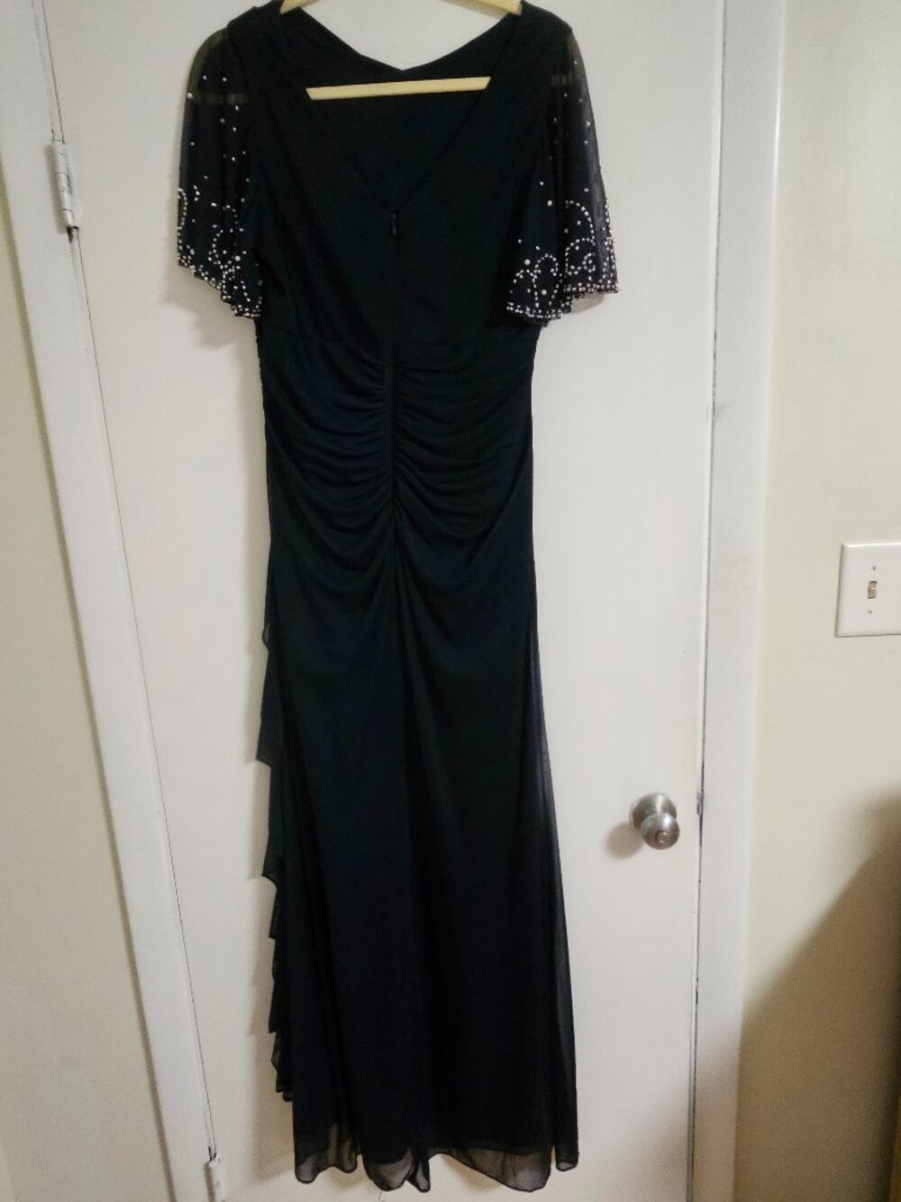 Betsy & Adam Navy blue size 14. Beaded sleeve Ruched floor length gown.